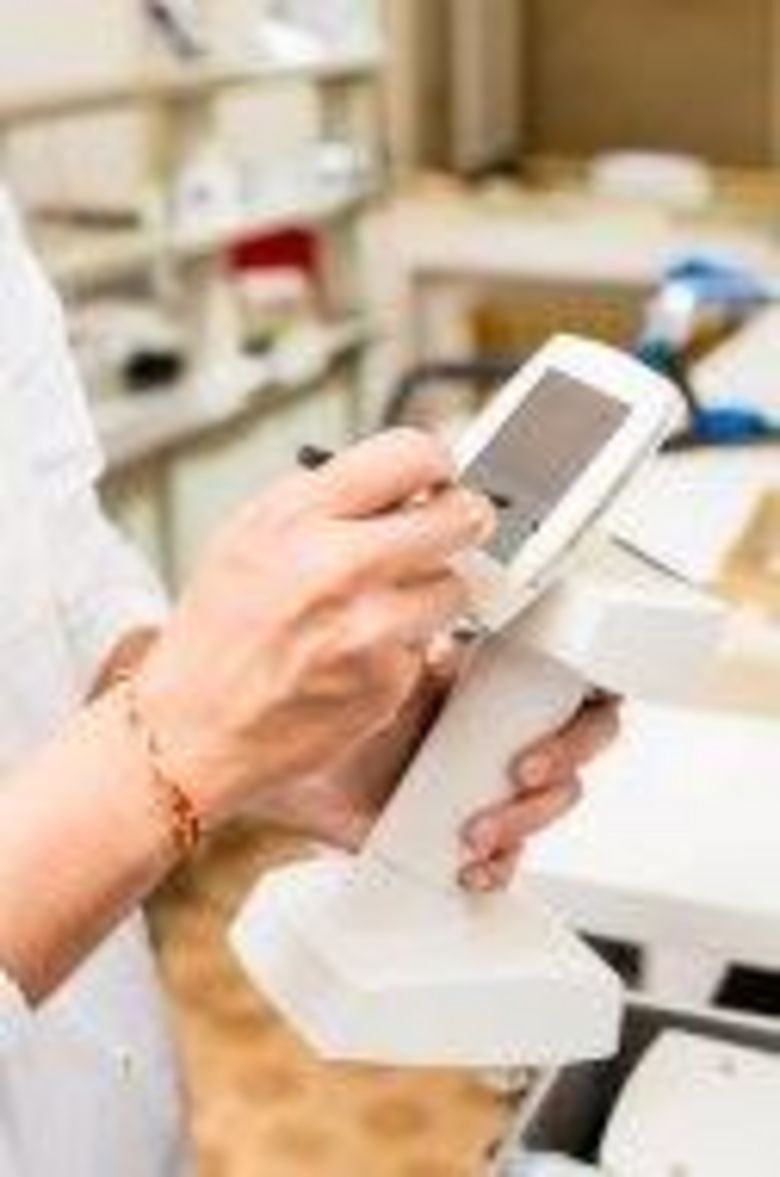 stock-photo-46761258-dental-technician-using-touch-screen.jpg